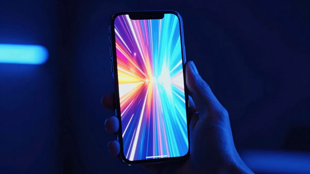 Vertical Instagram Reel being generated on an iPhone held in one hand, Vodu AI dark violet interface